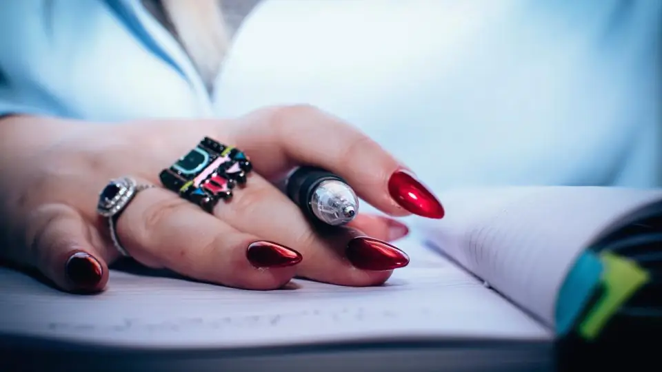Close-up of a client's hands and painted nails